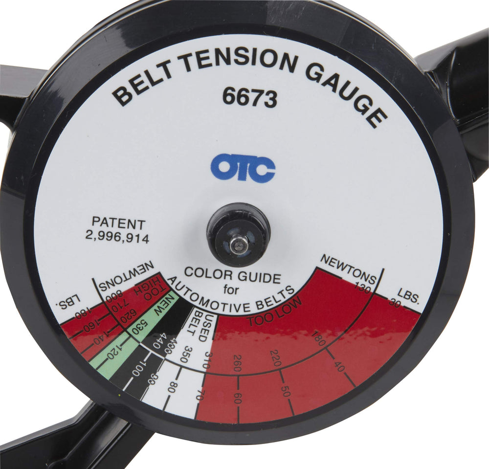OTC 6673 in use on a car belt illustrating correct tension checking technique