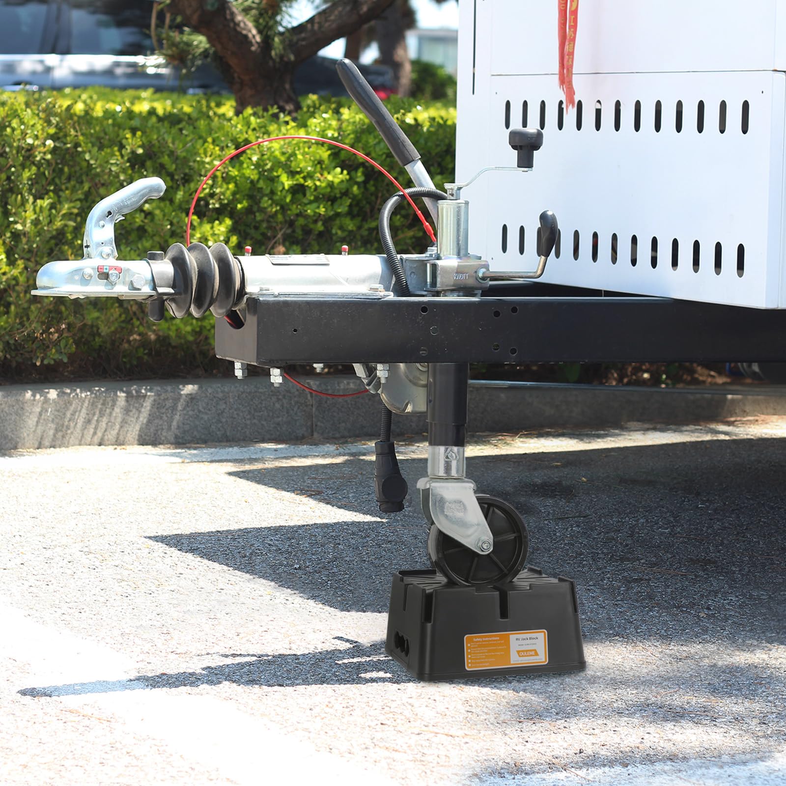 OULEME blocks under a travel trailer at campsite showing reliable leveling