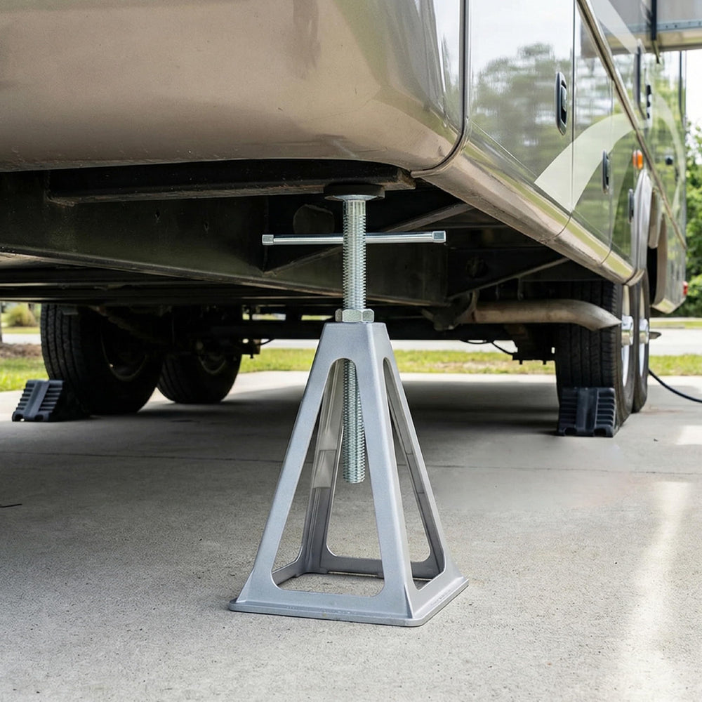 OULEME jack next to a wrench showing adjustable height scale and transportable size