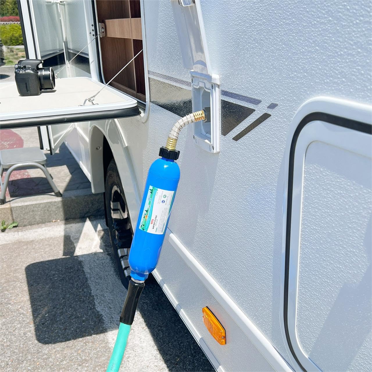 OULEME filter beside standard water bottle showing compact size and portability