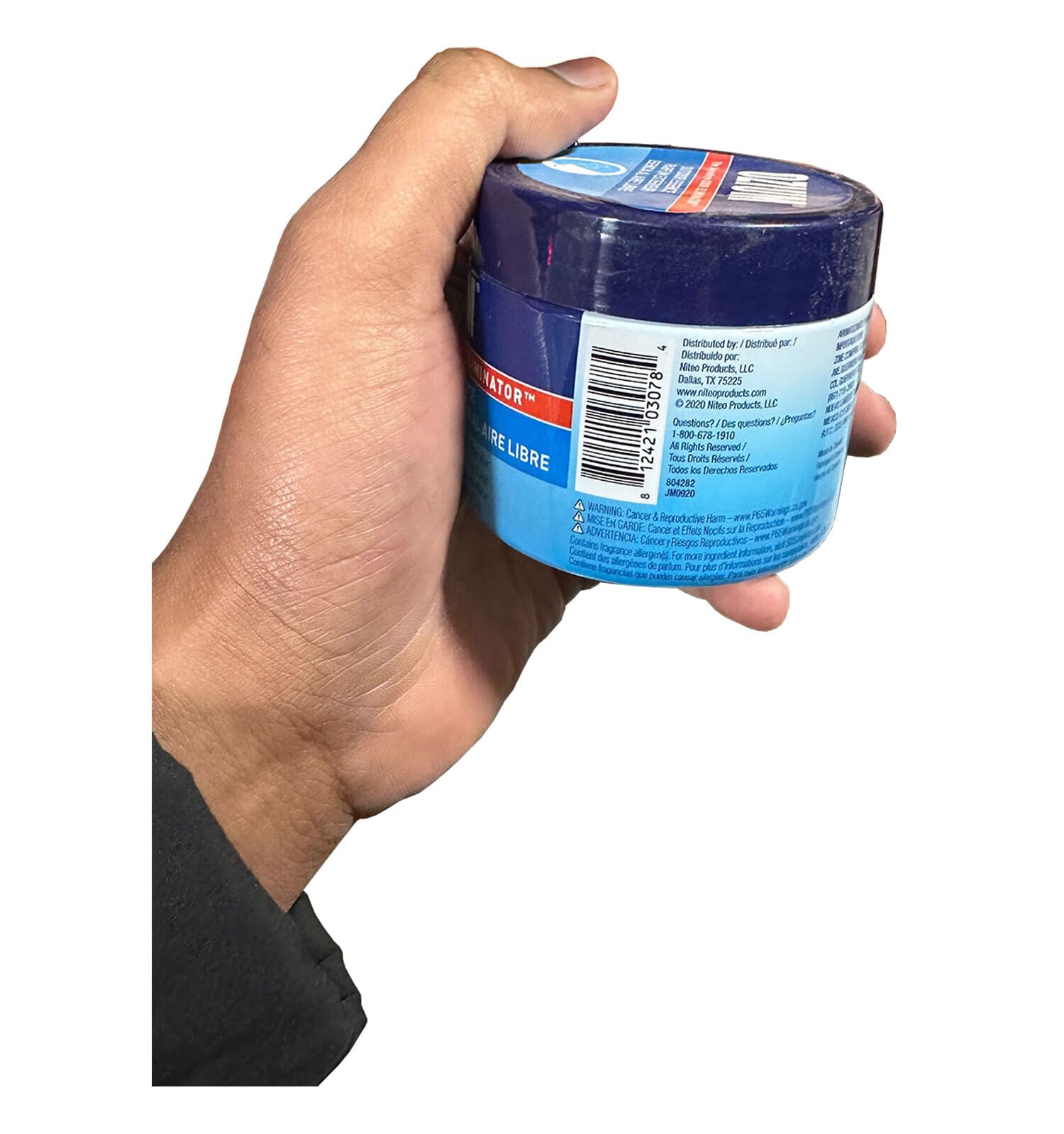 Ozium on bathroom counter providing discreet odor control for small rooms