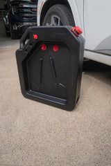PAK drain pan in use under a car demonstrating fast collection and tidy work area