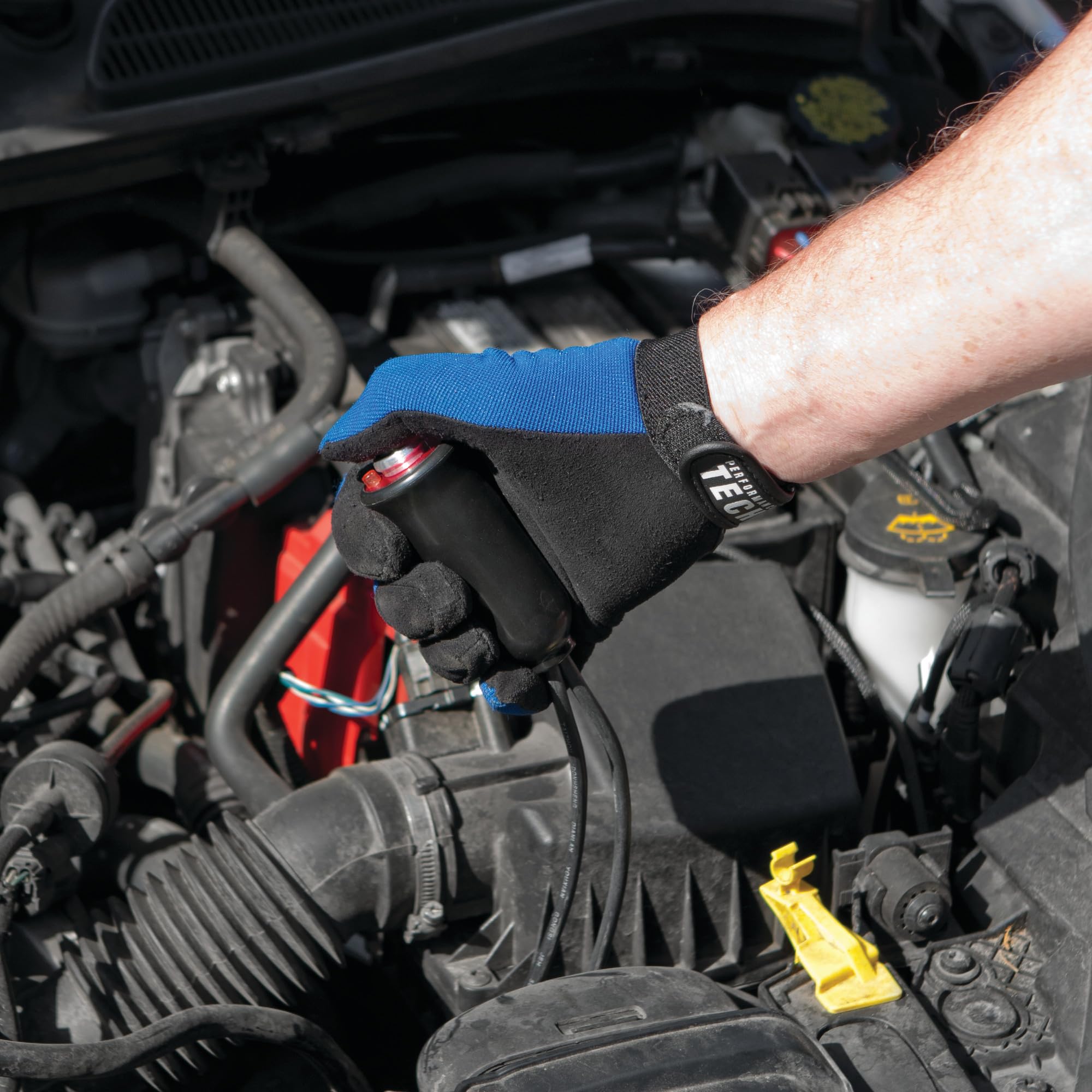 Performance Tool in-use in an engine bay enabling one-person starter crank safely