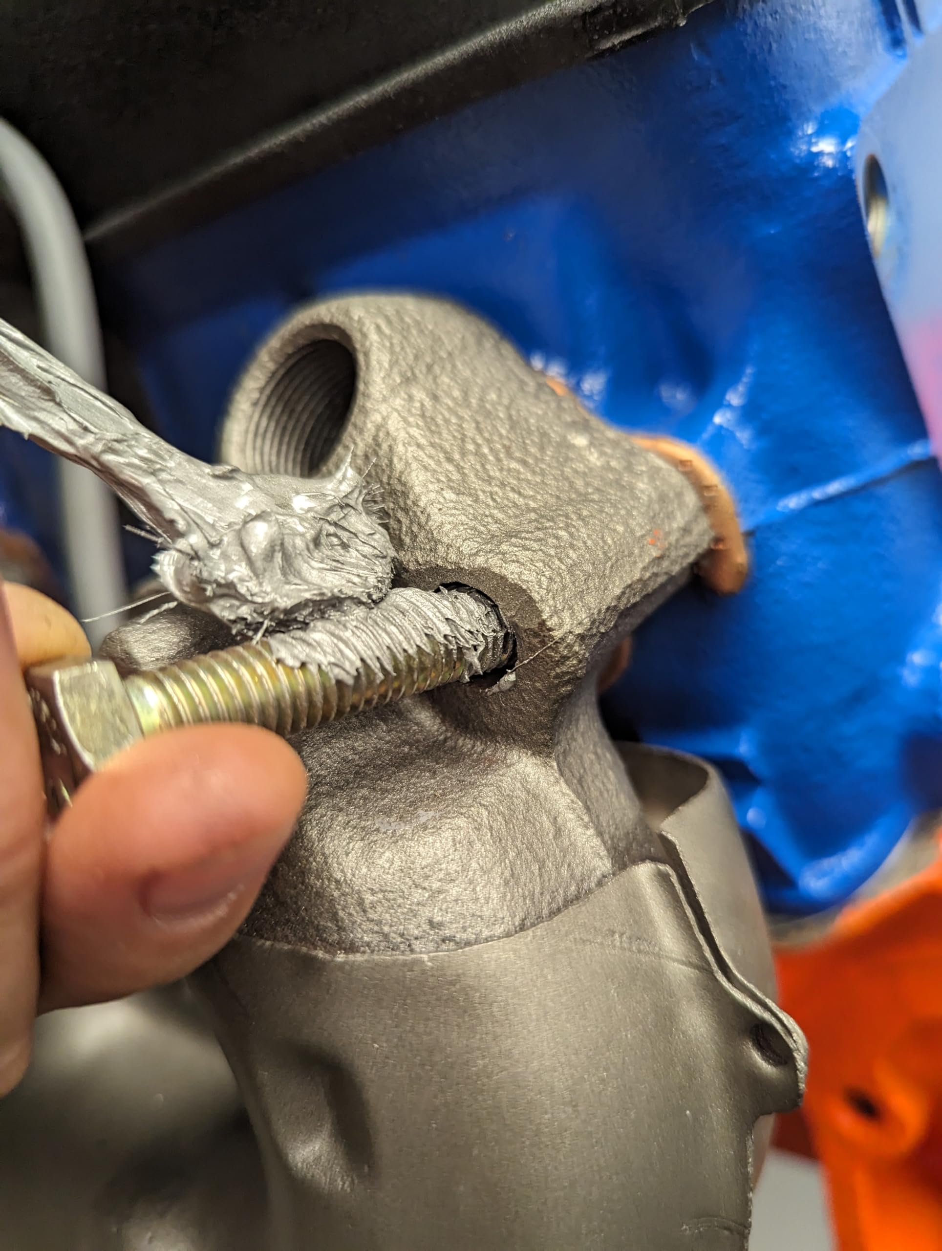 Permatex 80208 applied to a spark plug thread illustrating easier future removal benefit