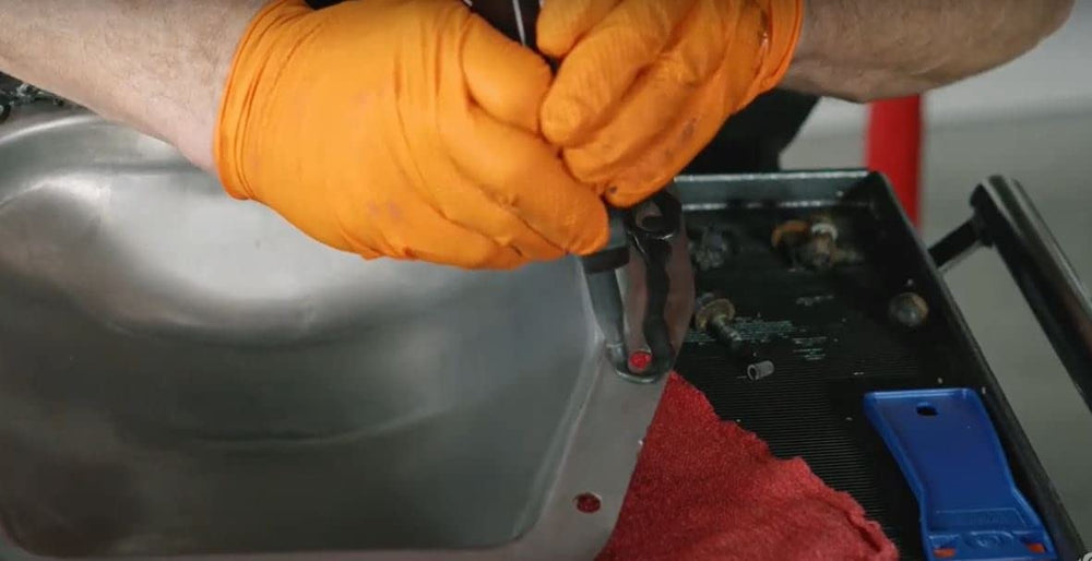 Permatex label close-up highlighting temperature and fluid resistance benefits