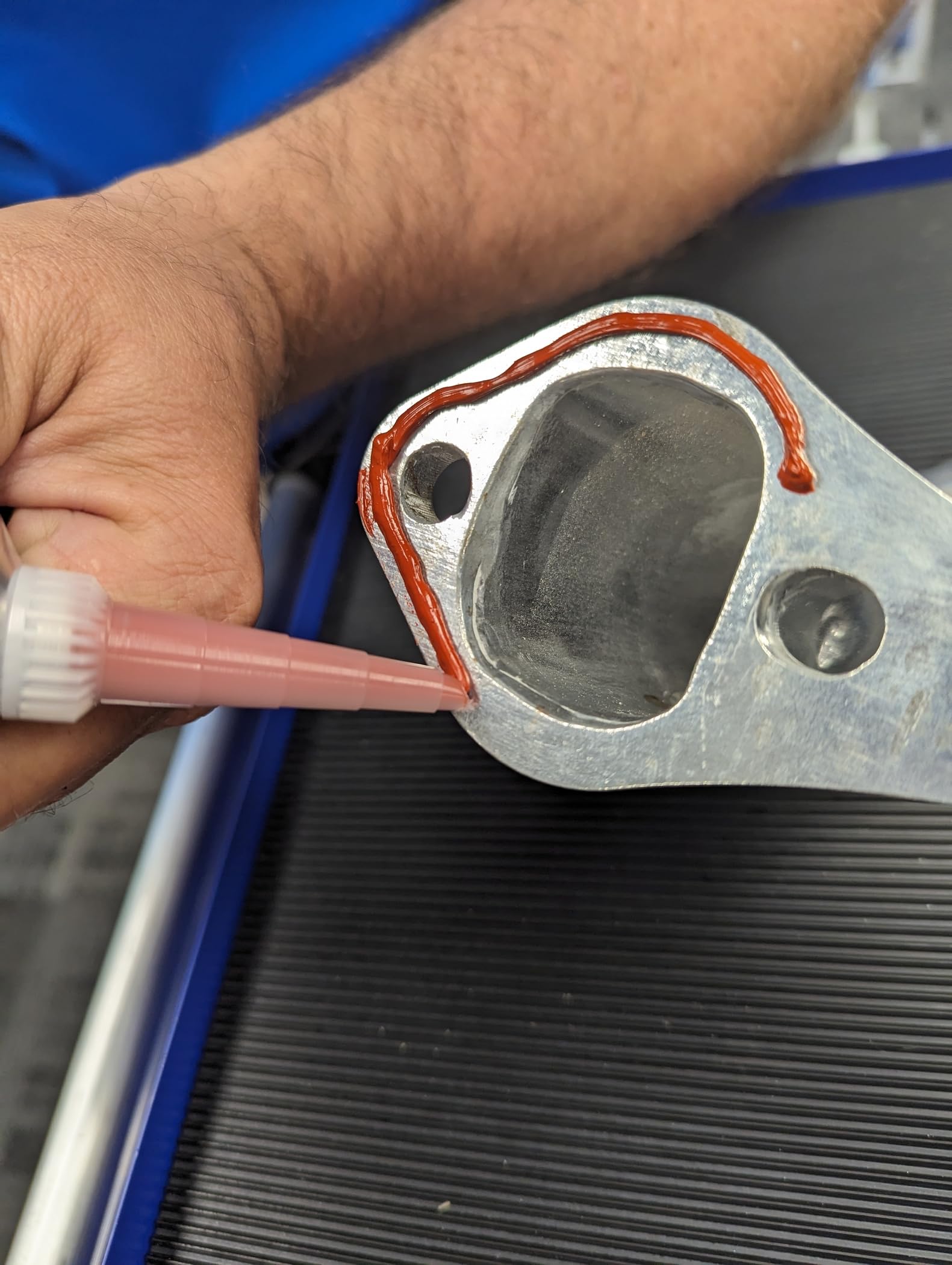 Permatex RTV applied to a valve cover demonstrating a durable formed-in-place gasket