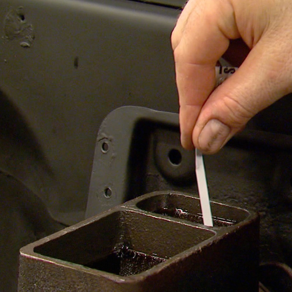 Phoenix Systems strip dipping into brake fluid reservoir to show quick testing