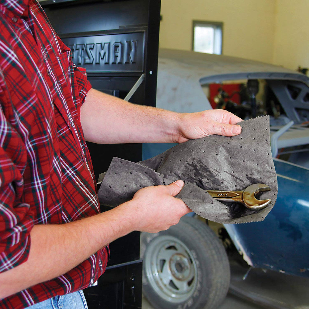 PIG mat roll on workbench protection absorbing drips and keeping tools clean