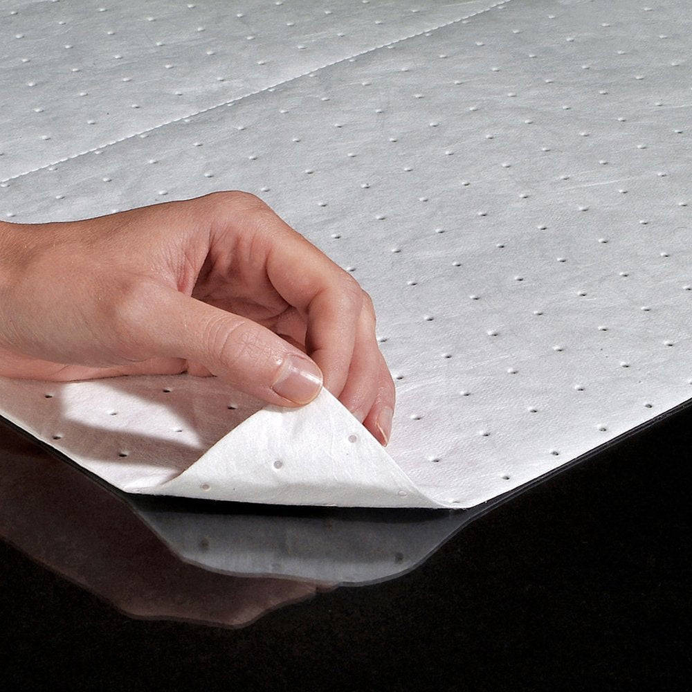 PIG pad floating on water to remove oil sheen from surface effectively
