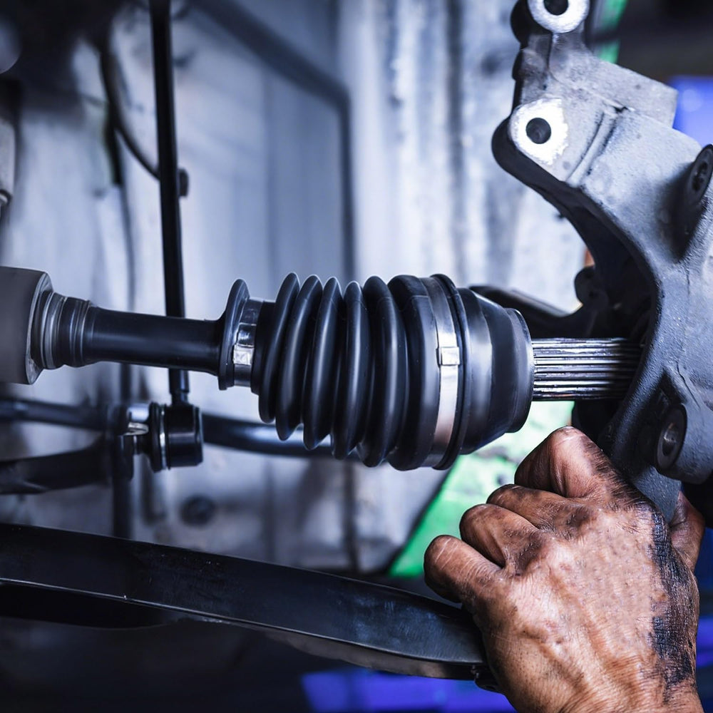 Pnkauto garage repair scene with technician using kit to save time and labor