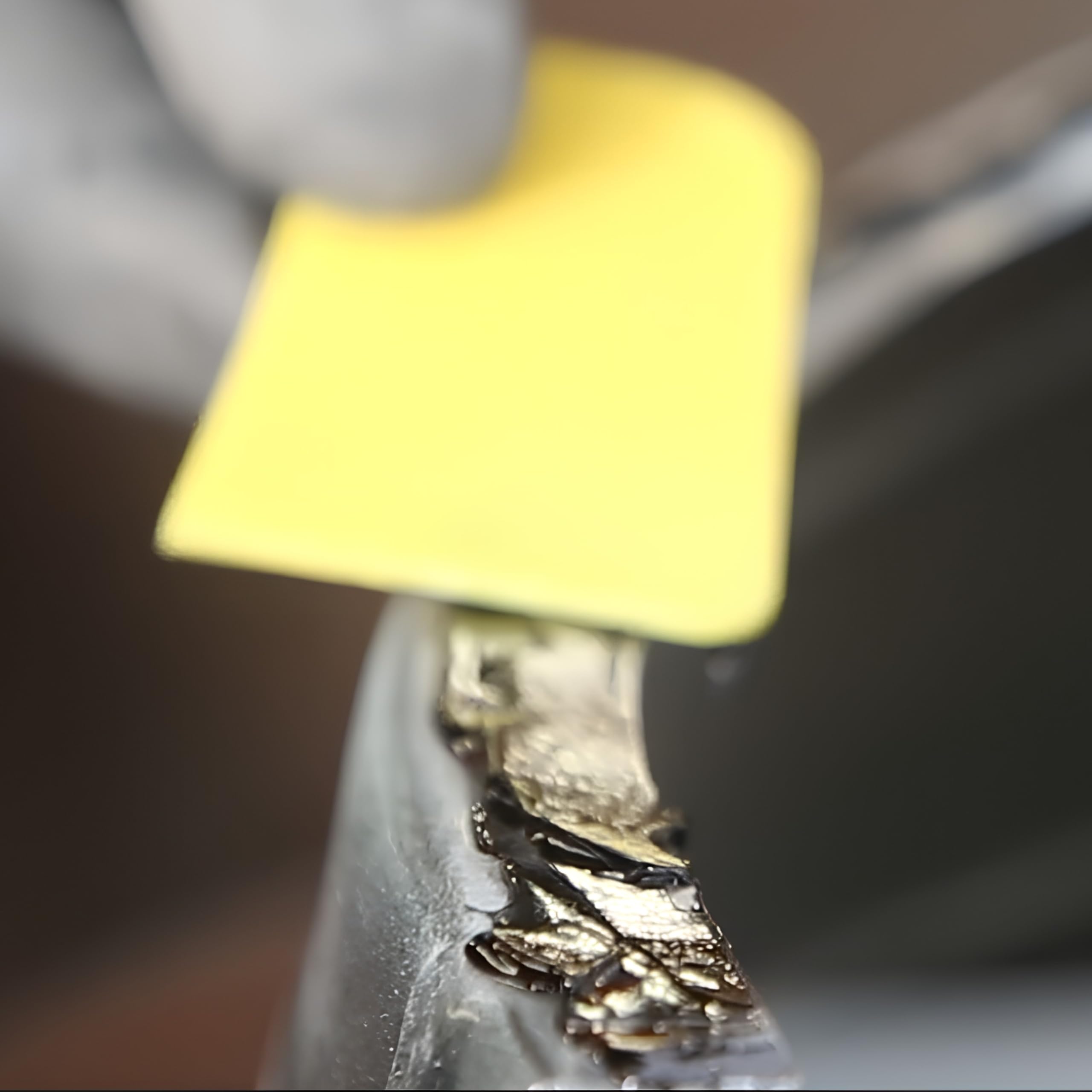 Polymix bead applied on metal panel showing clean gap-filling adhesion