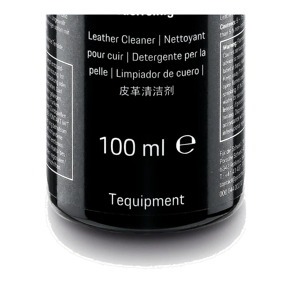 Porsche leather cleaner 100 mL next to a credit card showing compact travel-friendly size