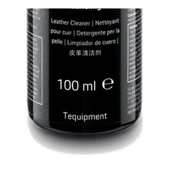 Porsche leather cleaner 100 mL next to a credit card showing compact travel-friendly size