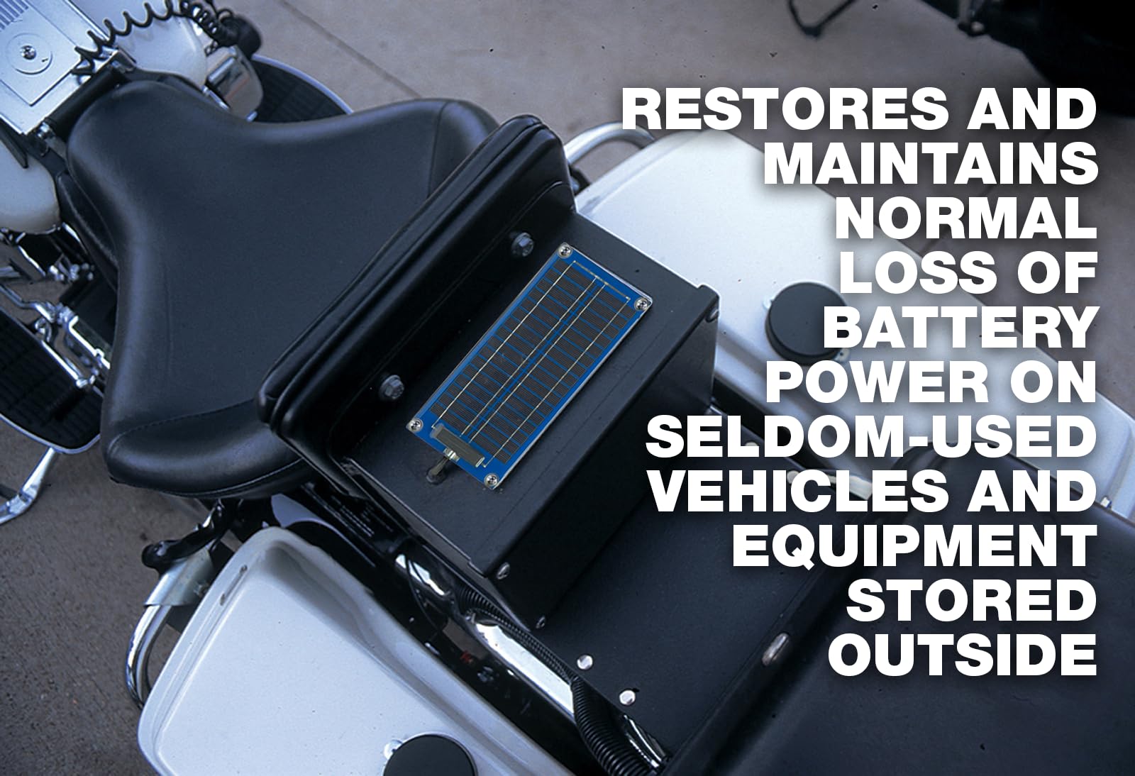 PulseTech SolarPulse installed on a stored motorcycle showing maintenance charging for readiness