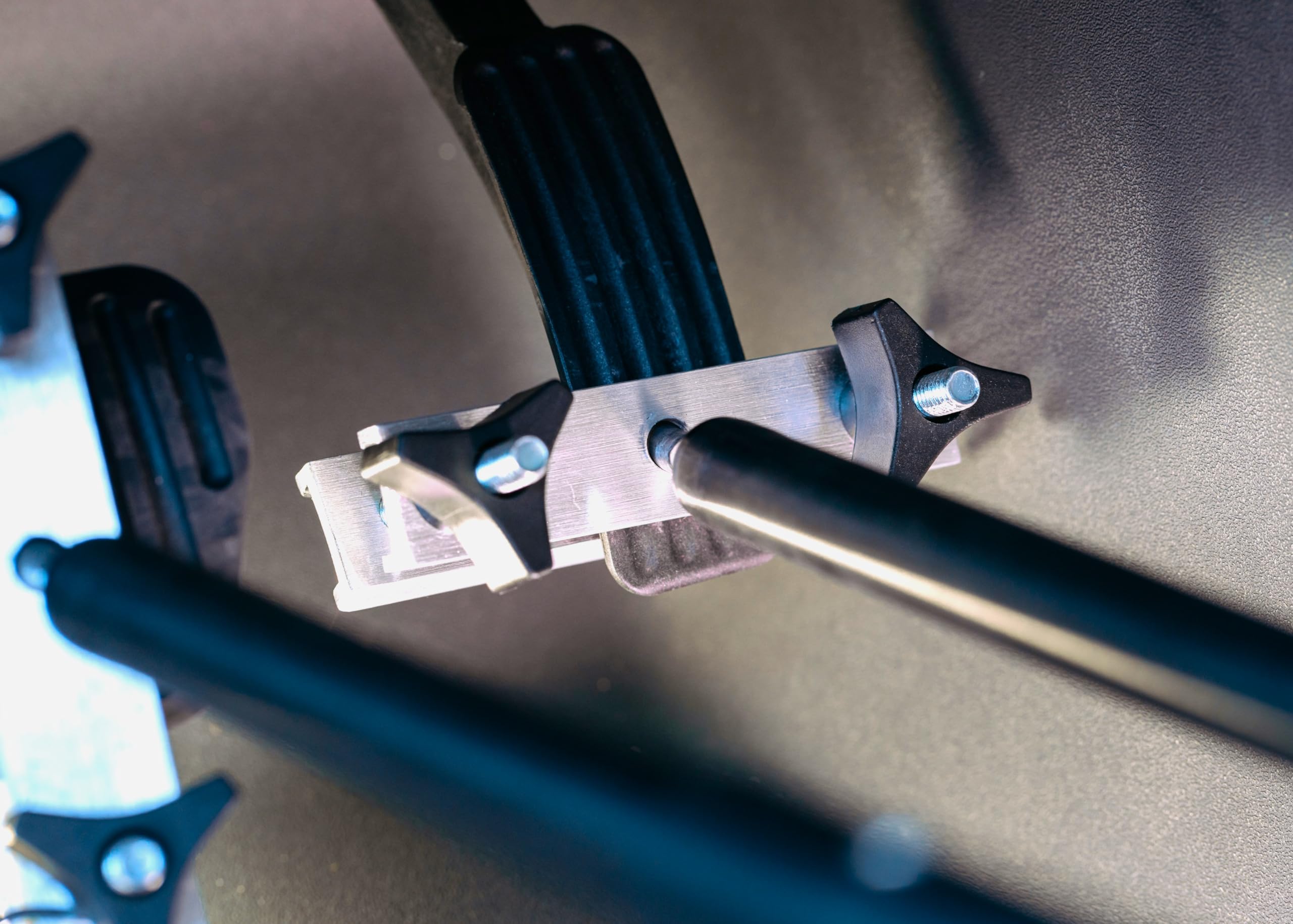 QuicStick clamp mechanism detail displaying easy-install fastening benefit