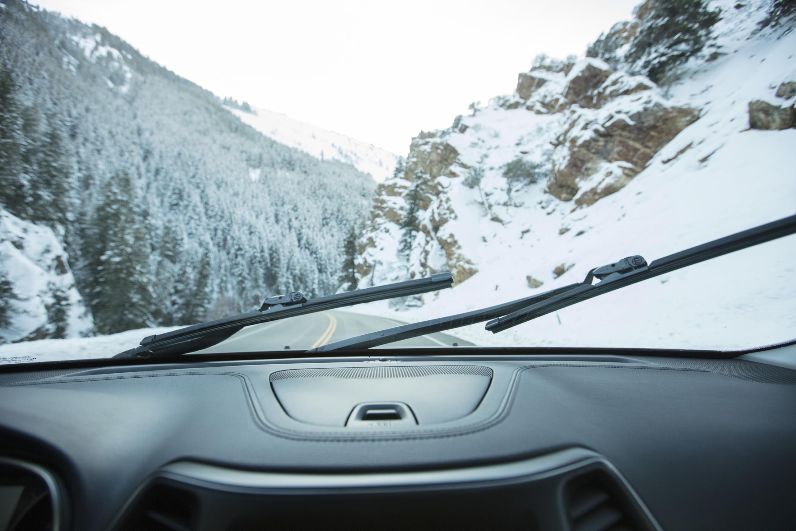 Rain‑X blade installed on car during commute showing reliable all‑weather use