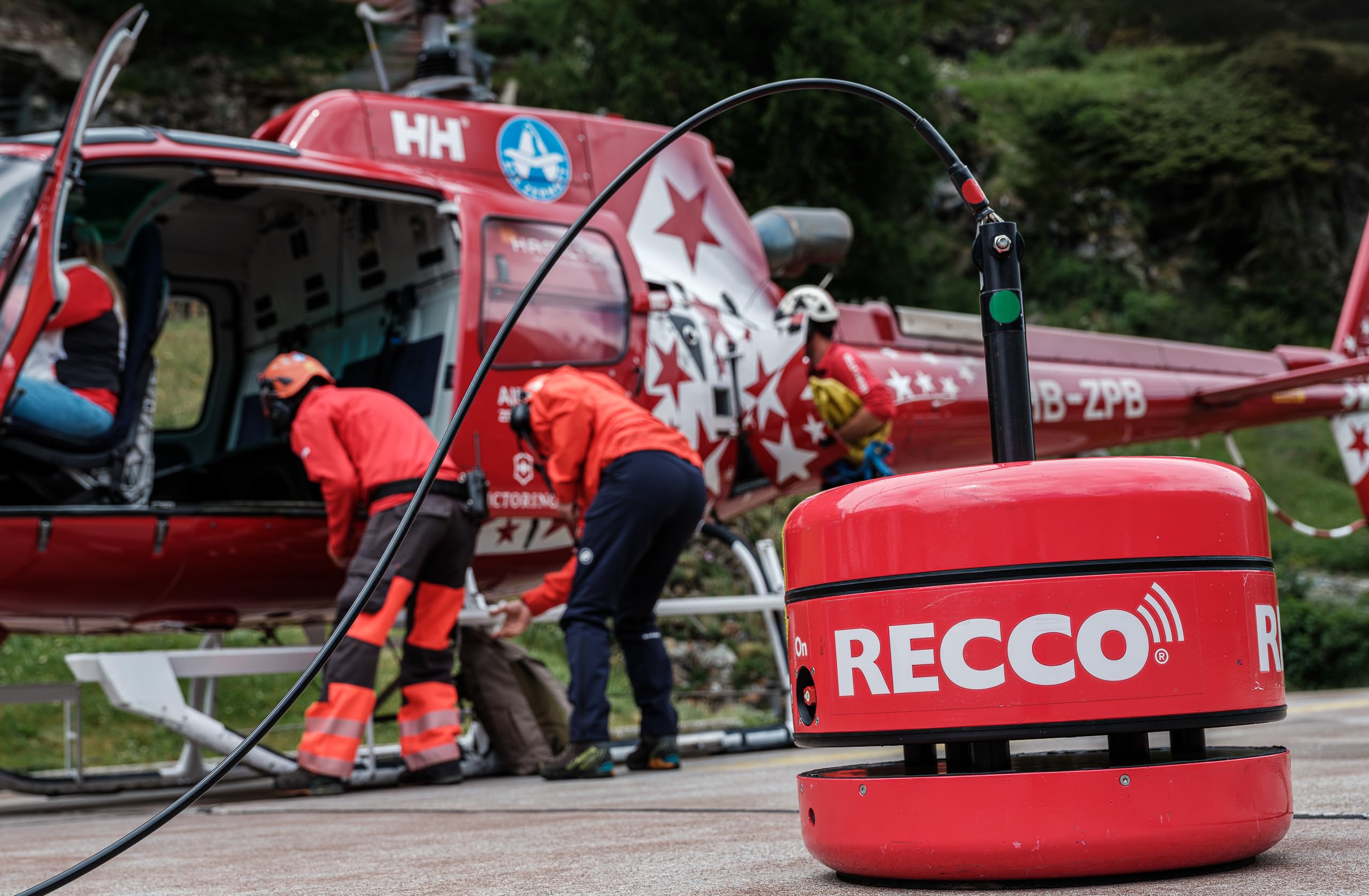 RECCO reflector on hiker backpack in trail setting increasing emergency visibility