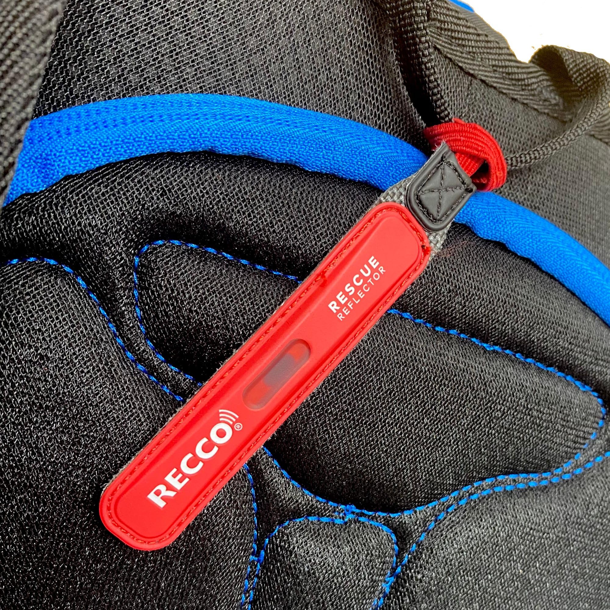 RECCO reflector on strap close-up highlighting secure fit for rescue detection