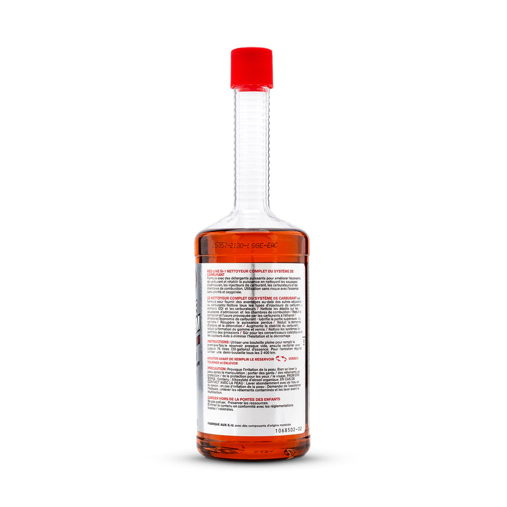 Red Line bottle in garage setting implying professional maintenance benefit