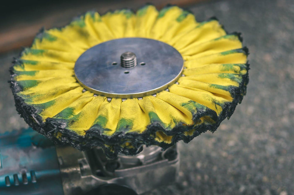 Renegade Products polishing wheel in use on aluminum rim demonstrating efficient material removal