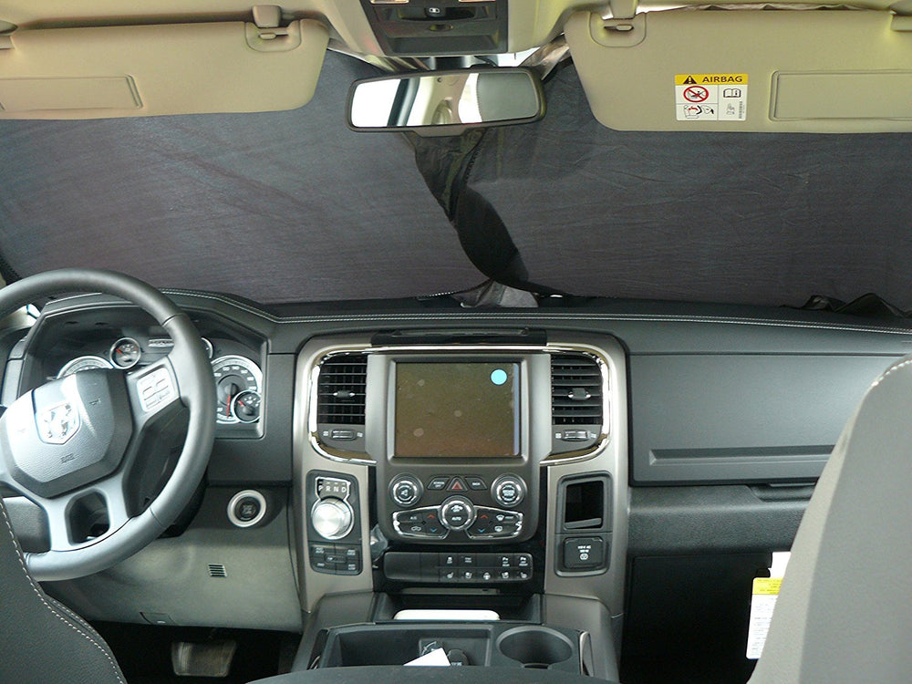 Road Charms sunshade in parking lot keeps vehicle interior cooler