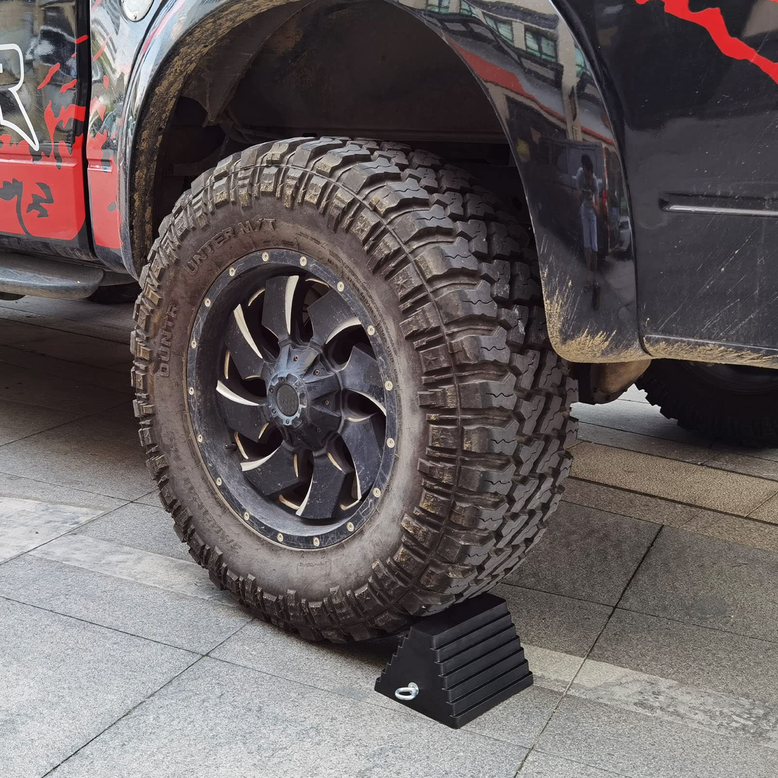 ROBLOK chock placed under RV tire demonstrating vehicle stability