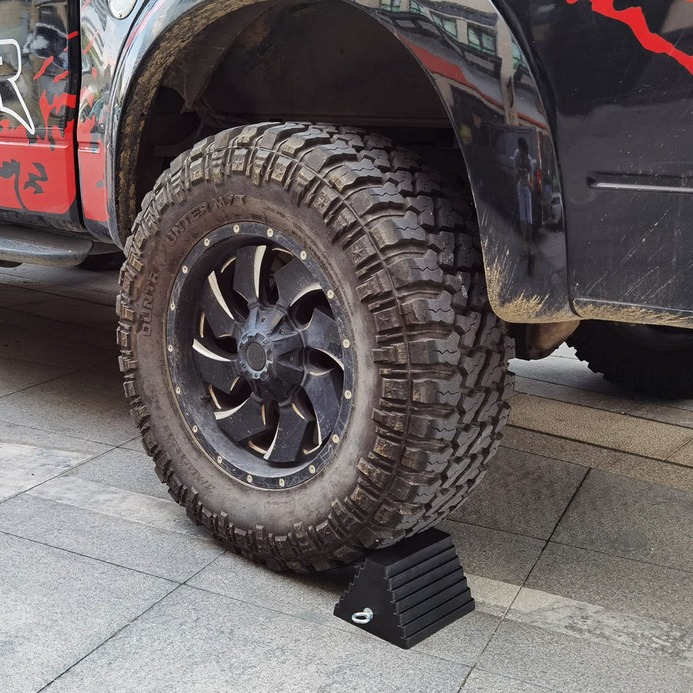 ROBLOK chock placed under RV tire demonstrating vehicle stability