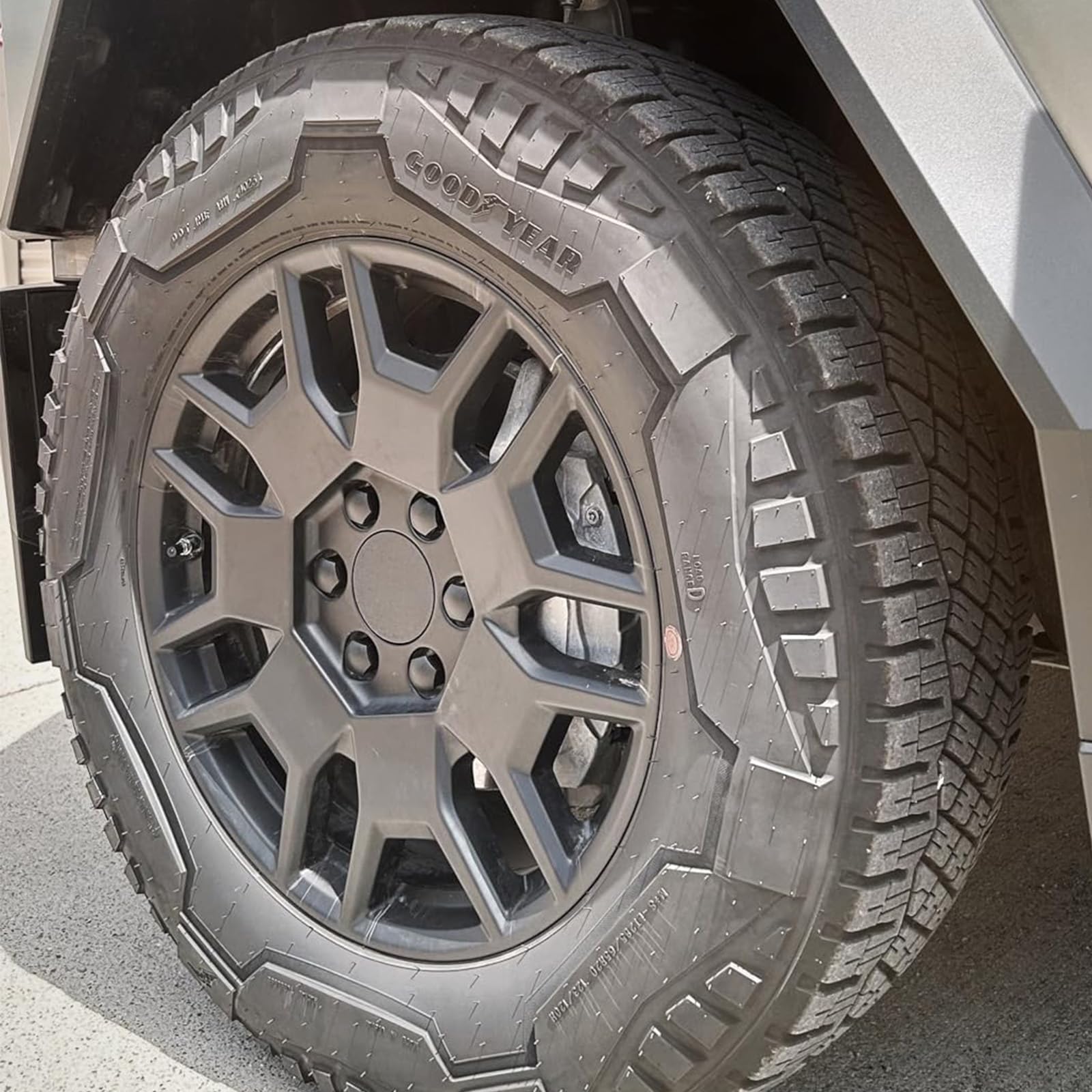 ROCCS caps on Cybertruck in driveway emphasizing refined, protected wheels