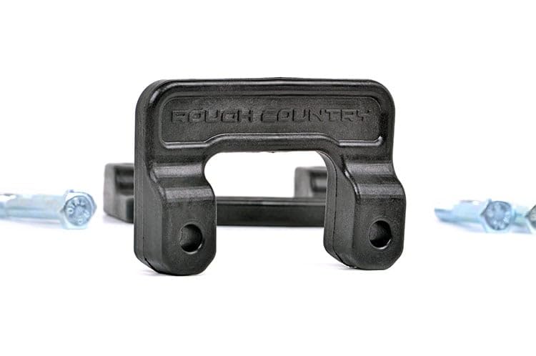 Rough Country-equipped truck offroad with level stance and improved approach