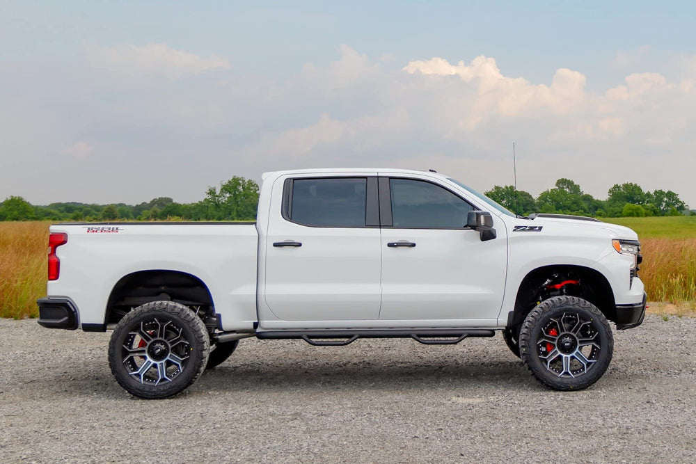 Rough Country delete on Silverado driving shot conveying refined aesthetics