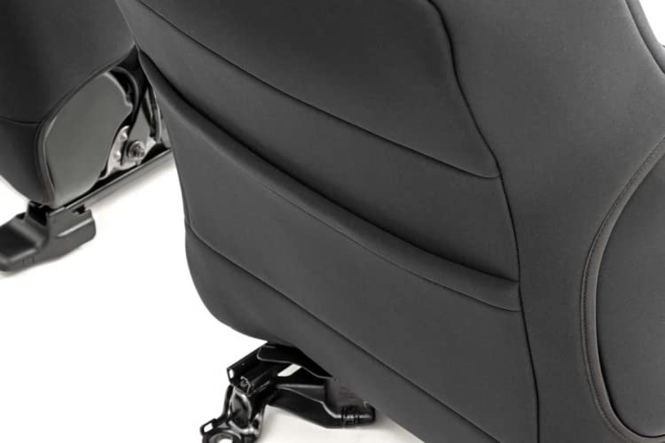 Rough Country seat covers installed in Tacoma front seats showing snug factory fit benefit