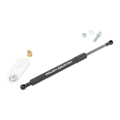 Rough Country assist next to tape measure, shows compact size and easy fitment