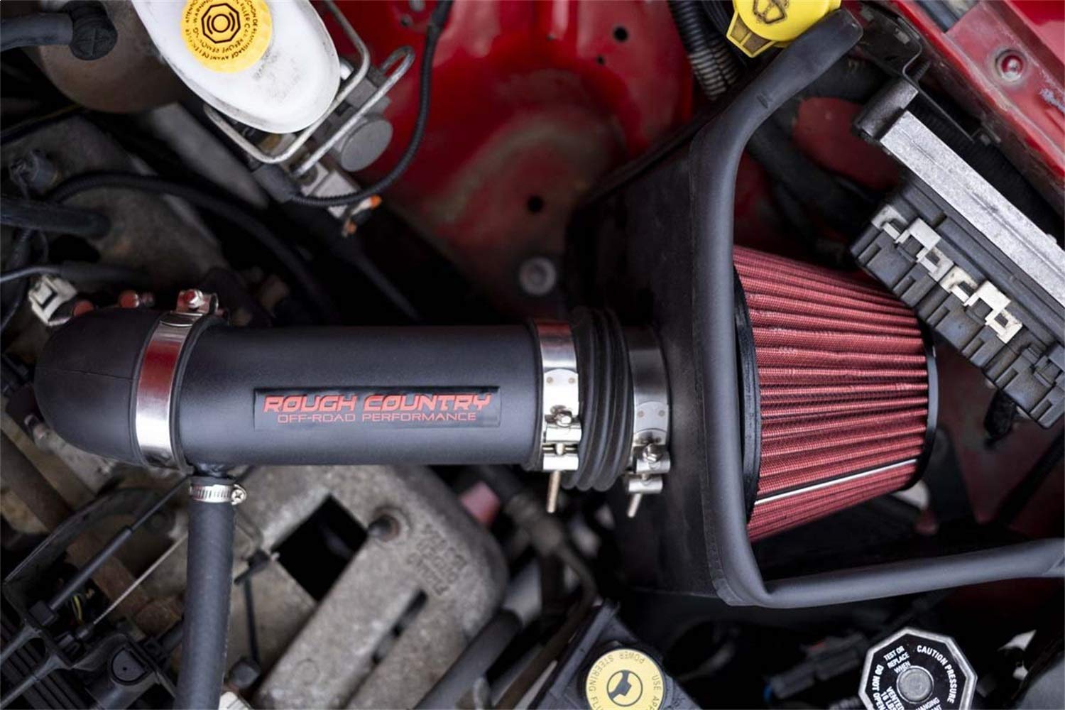 Rough Country cold air intake on truck off-road displaying performance and reliability