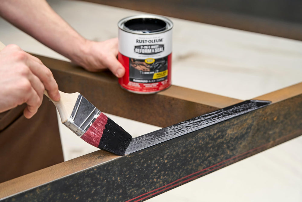 Rust-Oleum being applied under vehicle to seal rust and prevent corrosion
