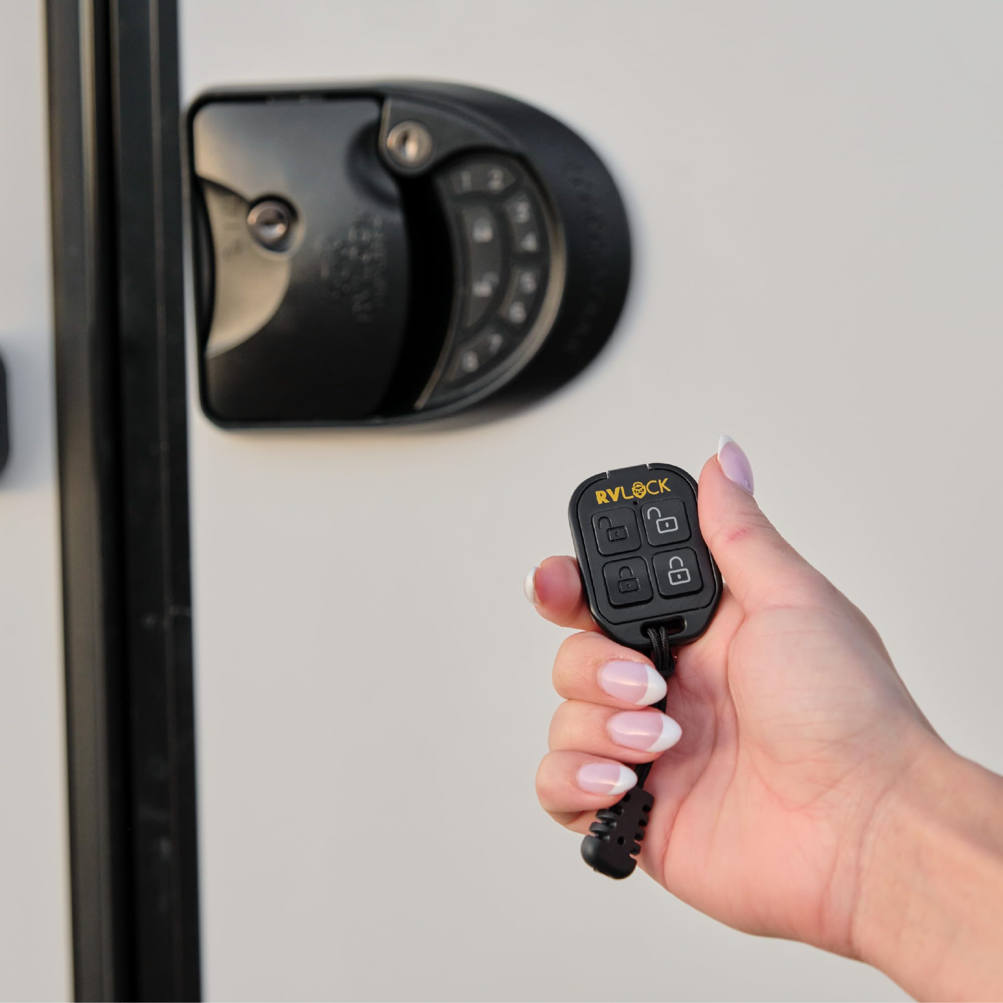 RVLock fob held in hand to show real-world scale and effortless pocket portability