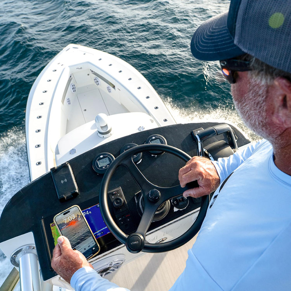 Scanstrut charging a phone through a waterproof case for convenient power