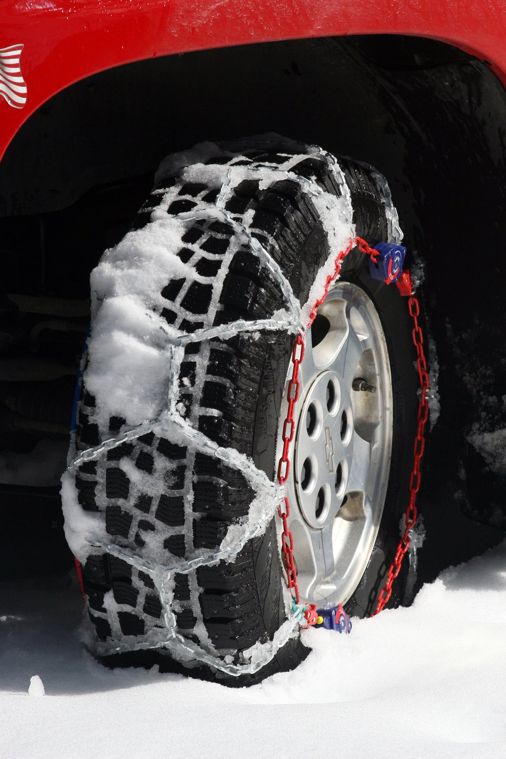 SCC Auto-Trac installed on SUV tire showing improved traction on snowy road