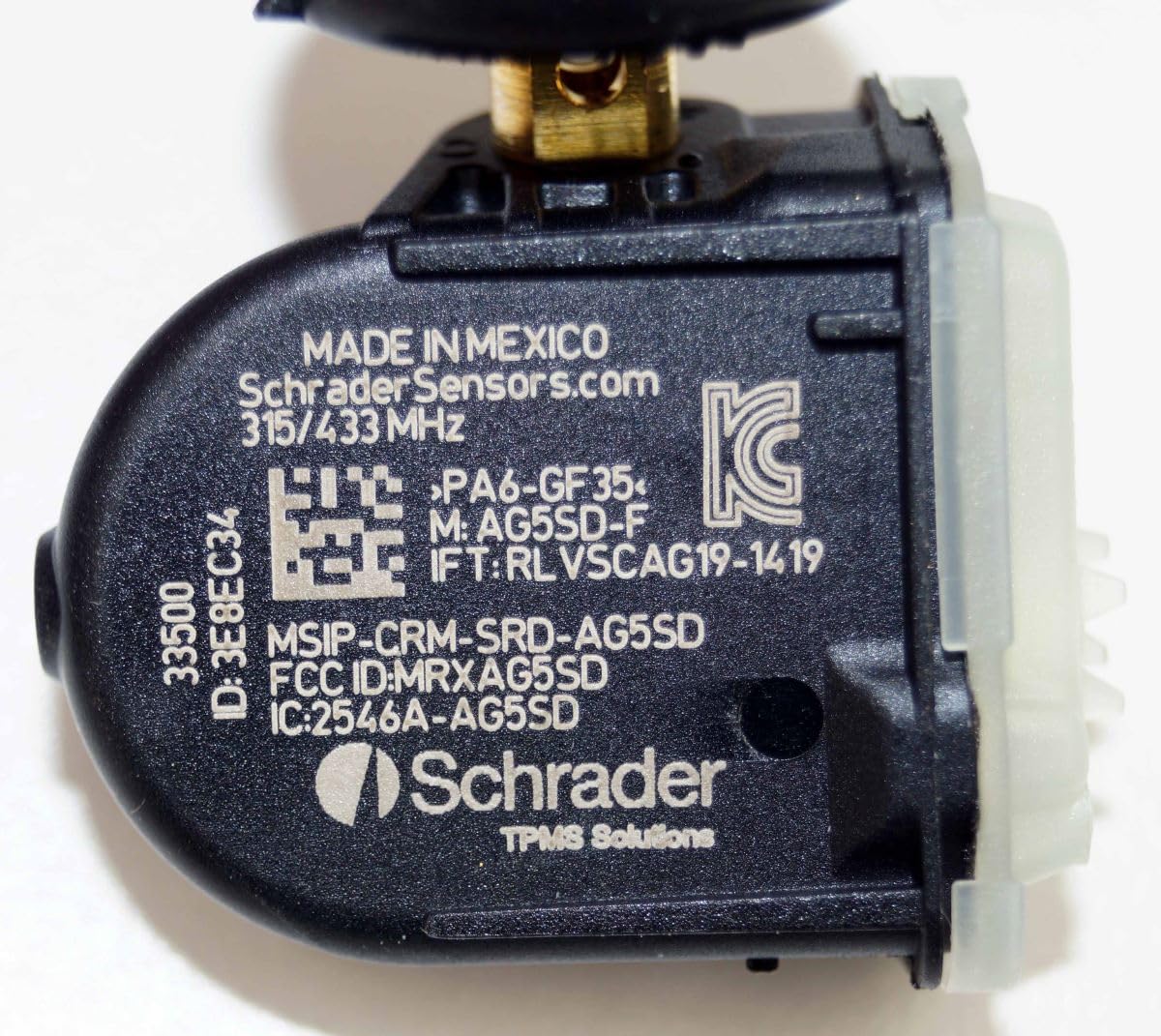Schrader sensor connected to programming tool illustrating easy technician setup
