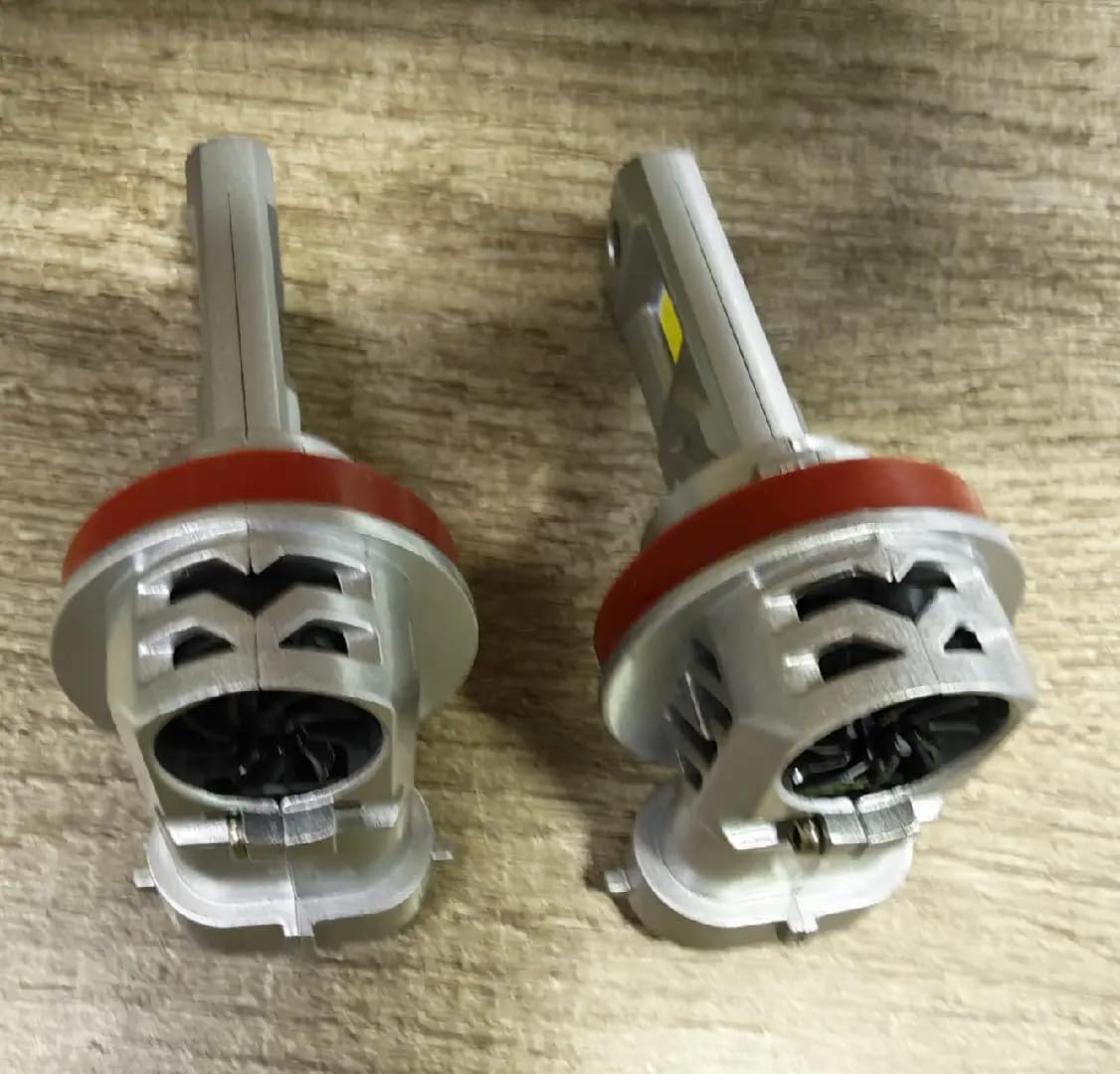 SEALIGHT H11 bulb beside a halogen for size comparison and 1:1 fit