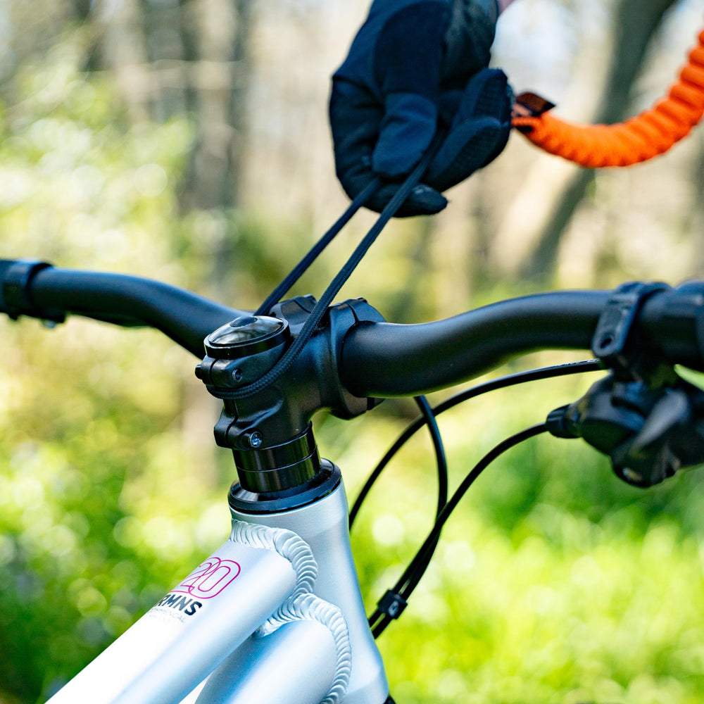 SHOTGUN rope in use with adult towing child on trail showing easier riding