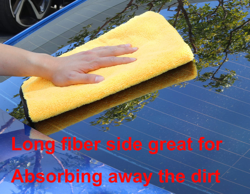Simple Houseware towel held by hand showing 16x24 scale and easy handling
