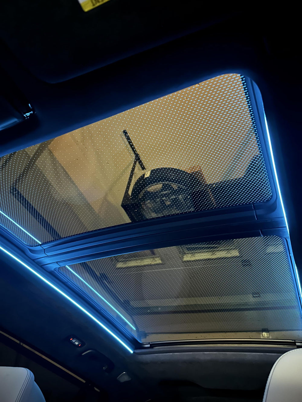 Sky Lounge ambient lighting in night drive scene enhancing atmosphere without altering vehicle systems