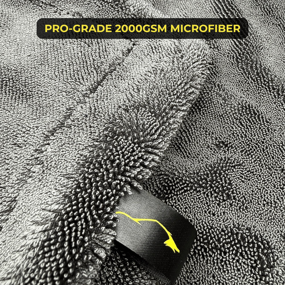 Sleek Dudes towel spread on car hood demonstrating large coverage benefit