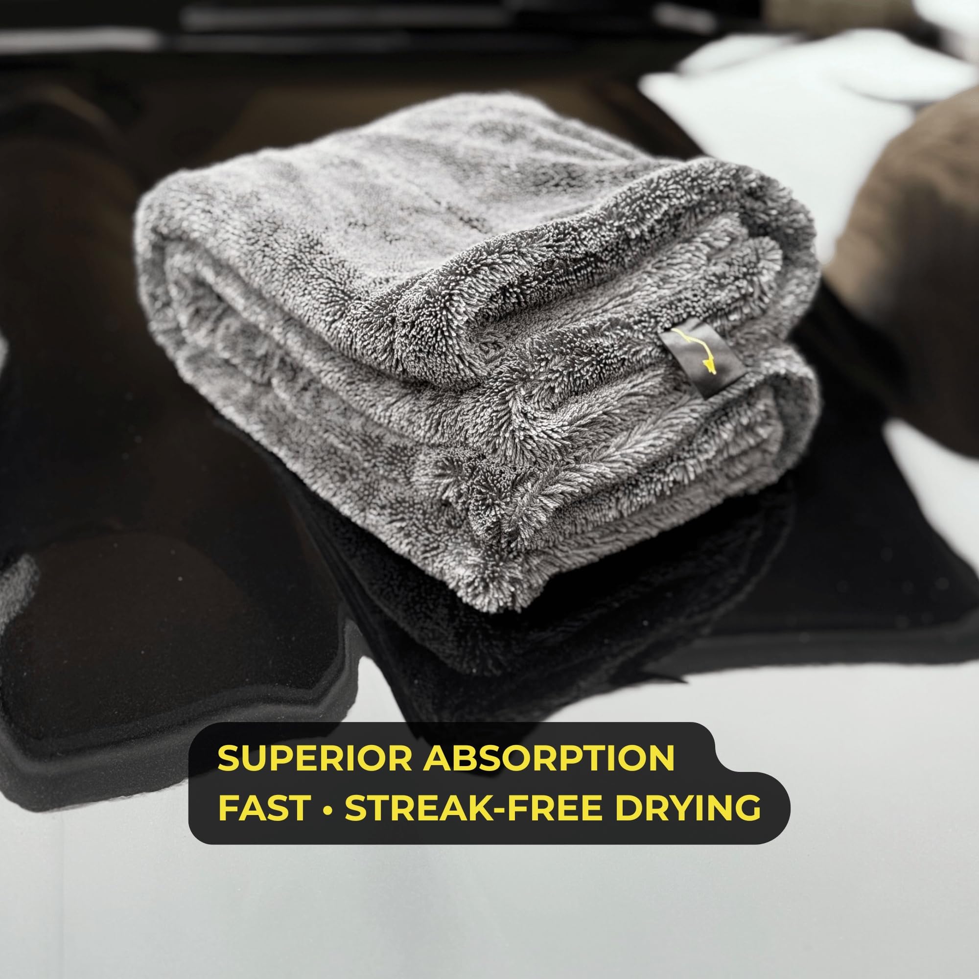 Sleek Dudes towel drying an SUV illustrating efficient streak-free drying