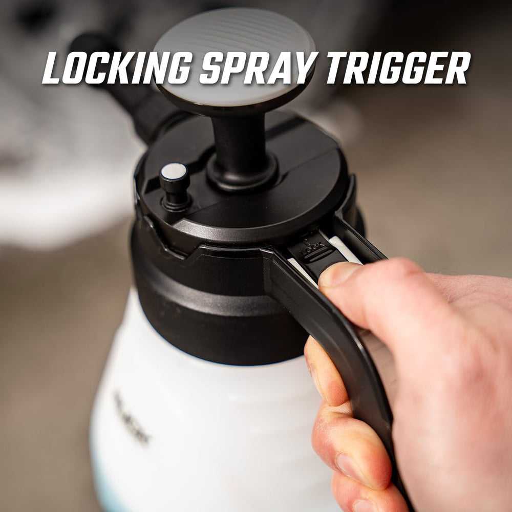 Slick Products emitting fine mist over vehicle for gentle rinseless cleaning