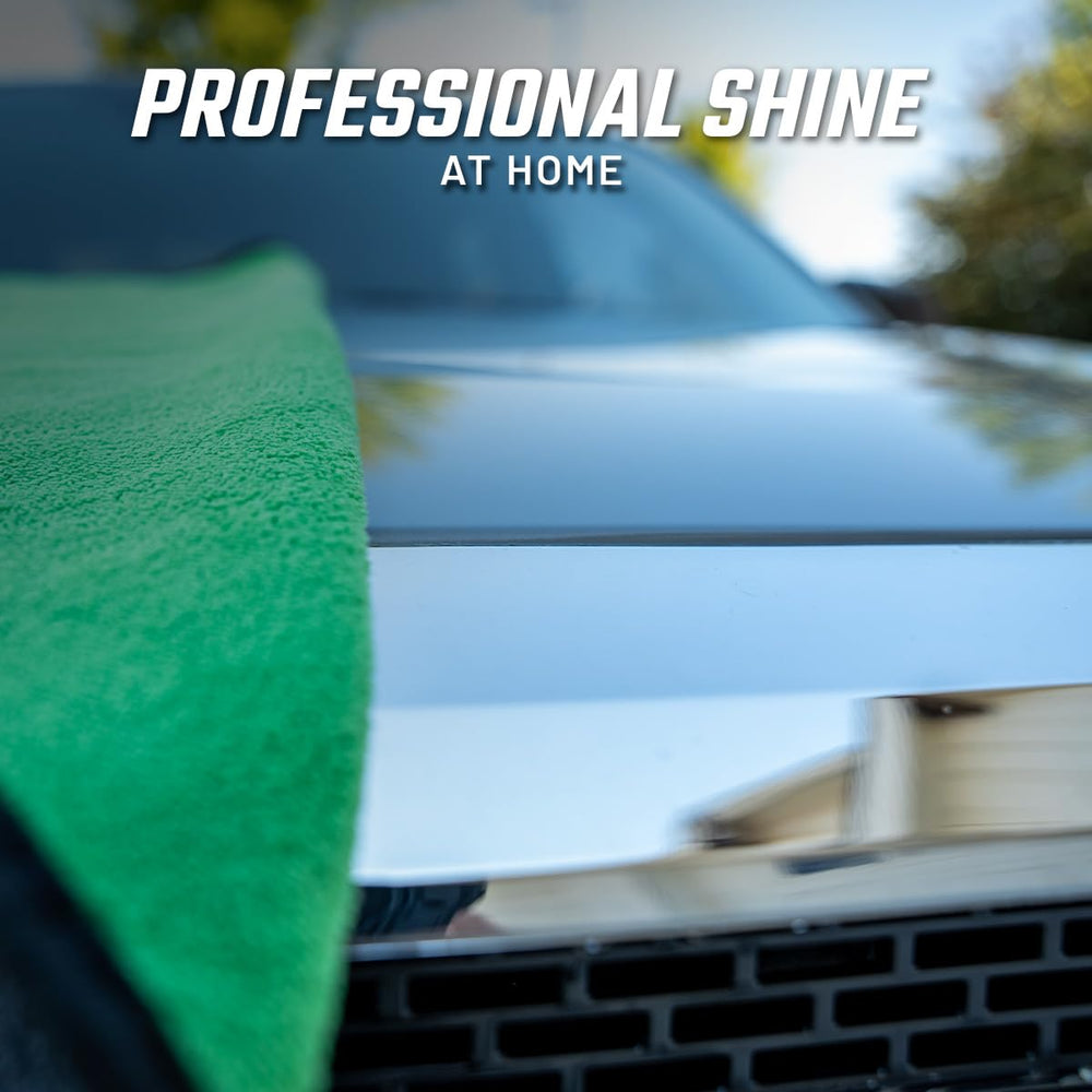 Slick Products lifestyle driveway wash scene showing at‑home professional results and gloss