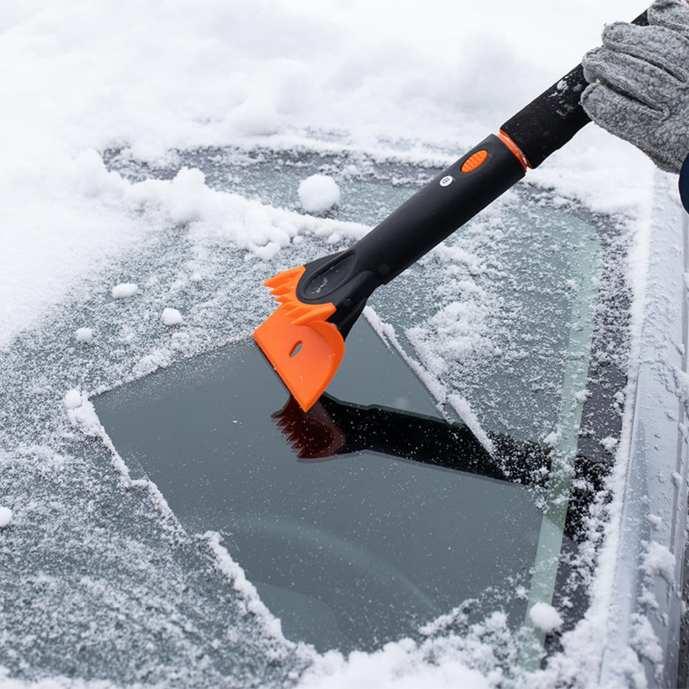Snow MOOver next to a hand for scale showing lightweight, portable design