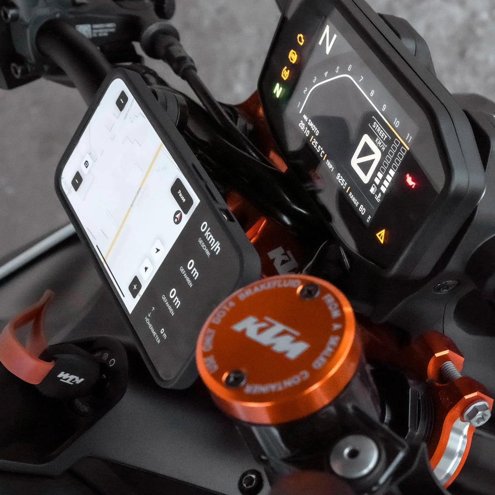 SP CONNECT mounted on motorcycle handlebar illustrating stable attachment and fit
