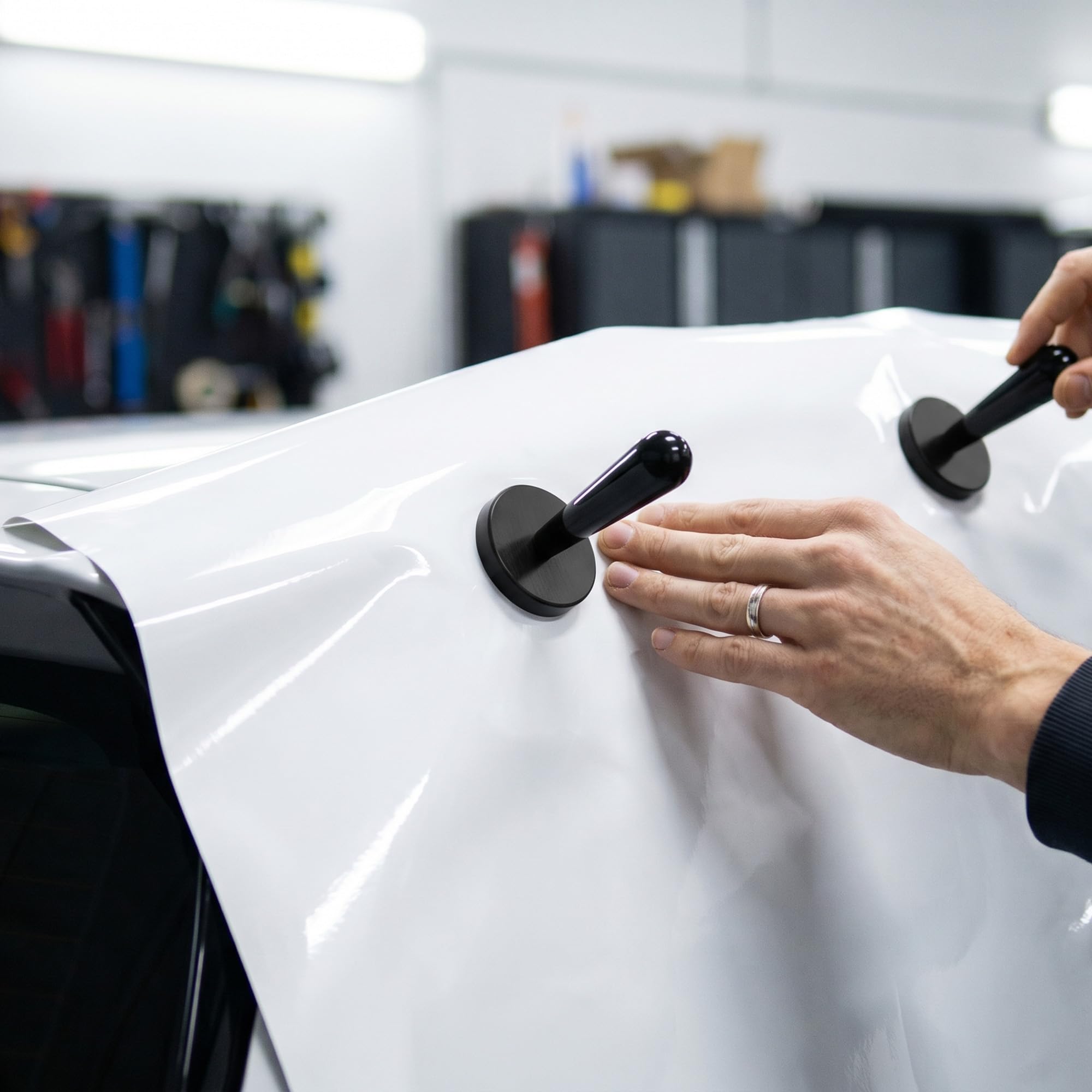 Spanno Tools heat gun on vehicle wrap softens vinyl for better contour adhesion