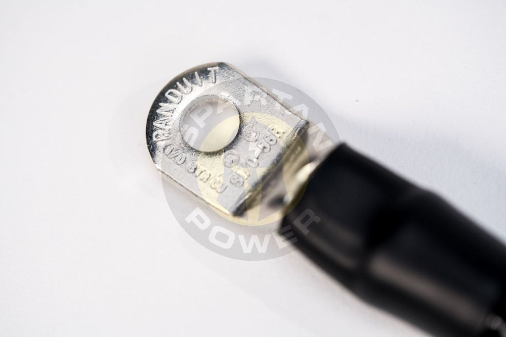 Spartan Power cables laid next to a ruler to show the 2-foot scale for easy planning